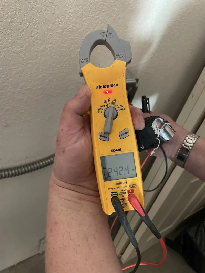 Voltage testing with clamp meter during Recessed Lighting Installation in Hodgenville